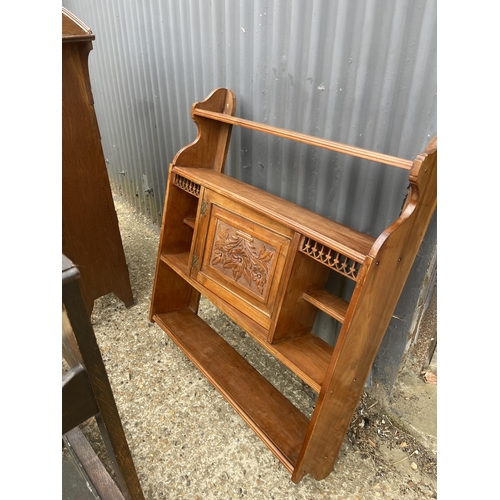 147 - An oak students bureau, carved wall rack and carved oak hall stand