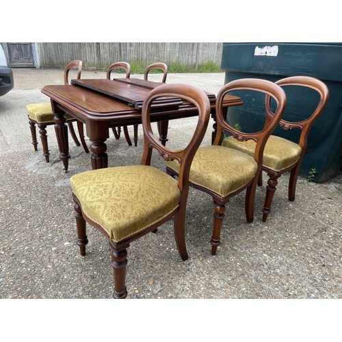 148 - A victorian mahogany extending dining table with two leaves 120x112 closed together with a set of si... 