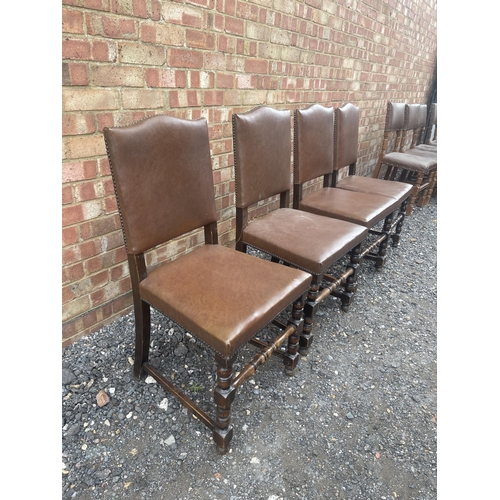 15 - A set of four oak and brown leather dining chairs