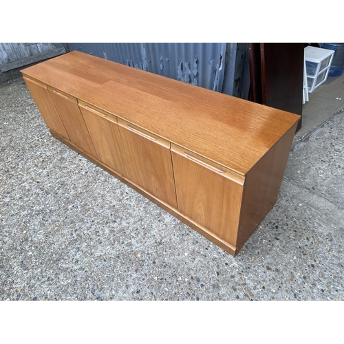 171 - A teak four door sideboard base unit by meredew