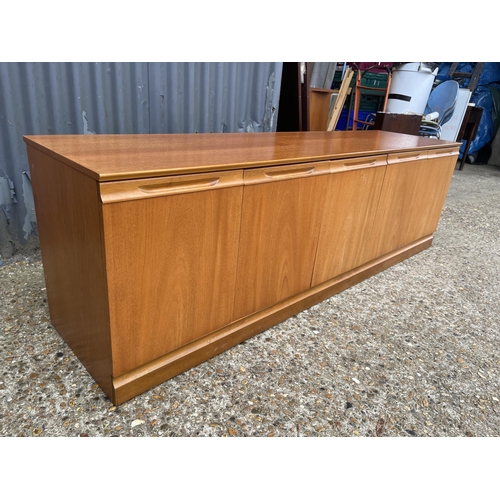 171 - A teak four door sideboard base unit by meredew