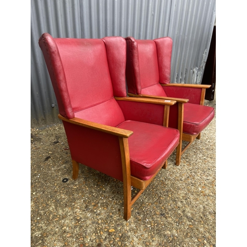 178 - A pair of red vinyl mid century wing chairs