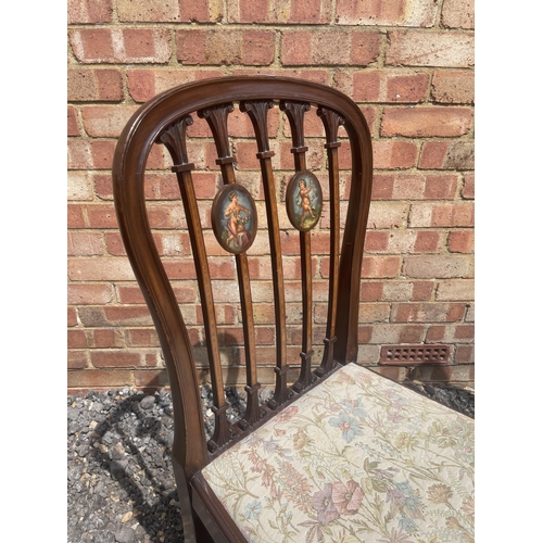 20 - A pair of Hepplewhite style Victorian mahogany chairs with painted panels in the backs