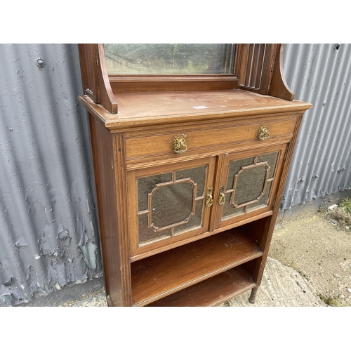 210 - An Edwardian mahogany cabinet