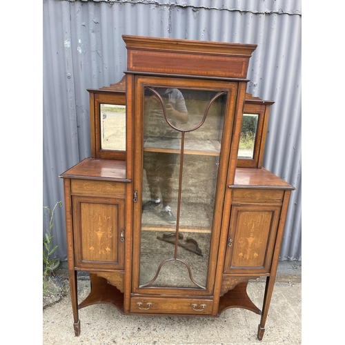 211 - An Edwardian mahogany cabinet with mirror back