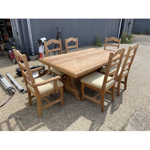 219 - A large solid pine refectory style dining table together with a set of six chairs 180x100x80