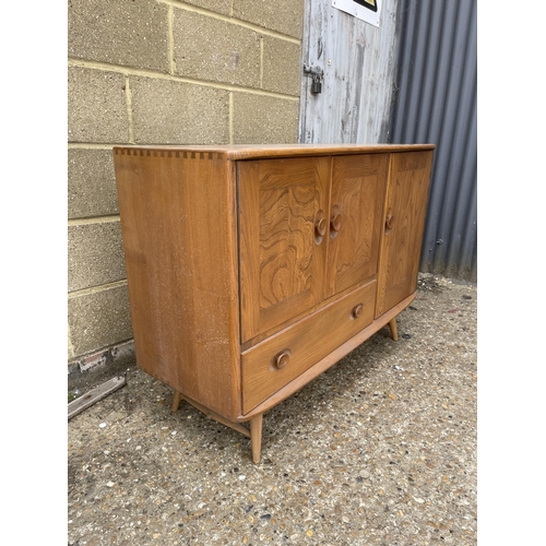 239 - An ercol light elm sideboard