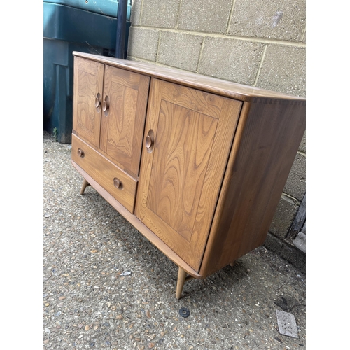 239 - An ercol light elm sideboard