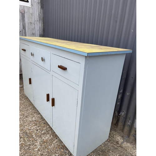 242 - A vintage blue painted sideboard with yellow formica top 138x46x93