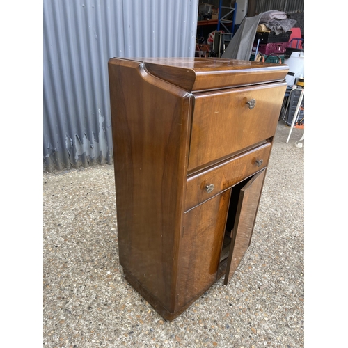 243 - A mid century walnut drinks cabinet