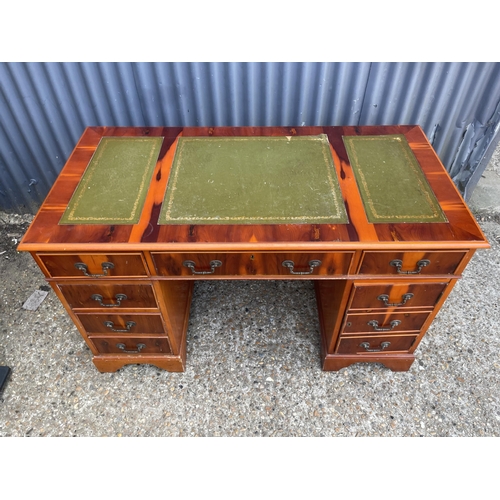 257 - A repro yew wood pedestal desk