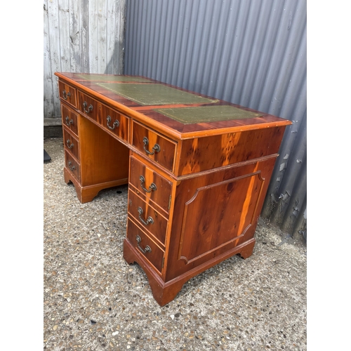 257 - A repro yew wood pedestal desk