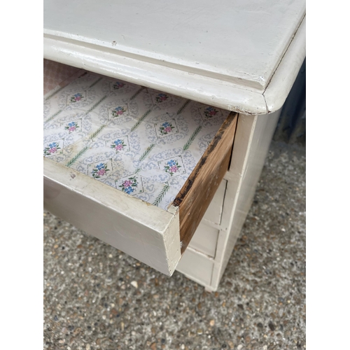 265 - A white painted pine chest of five drawers