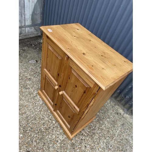 268 - A solid pine cupboard 74x44x100