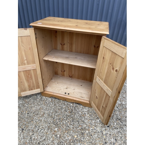 268 - A solid pine cupboard 74x44x100