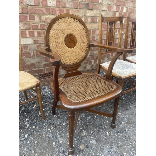 29 - A mahogany begere seated carver chair together with three Edwardian side chairs