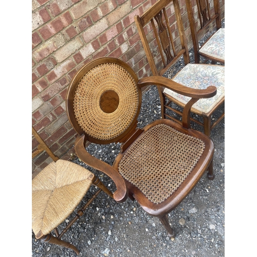 29 - A mahogany begere seated carver chair together with three Edwardian side chairs