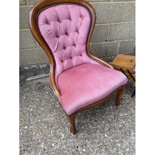 299 - A pink upholstered bedroom chair together with a concertina sewing box