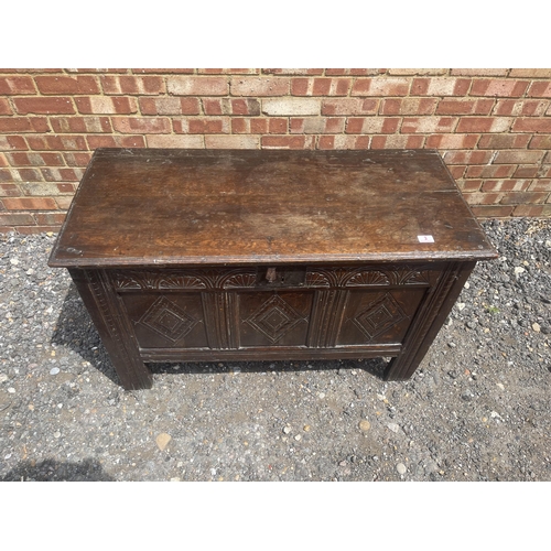 3 - An early oak three panel coffer / blanket box with key 110x50x70