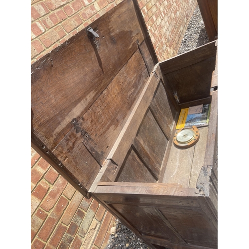 3 - An early oak three panel coffer / blanket box with key 110x50x70