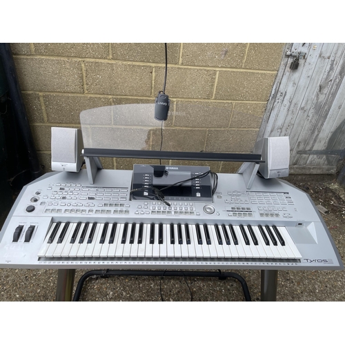 300 - A Yamaha tyros 2 electric organ together with speaker, dust cover, pedal and sheet music books