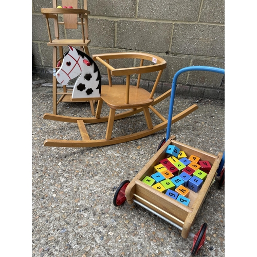 302 - A vintage children's high chair, push cart and rocker