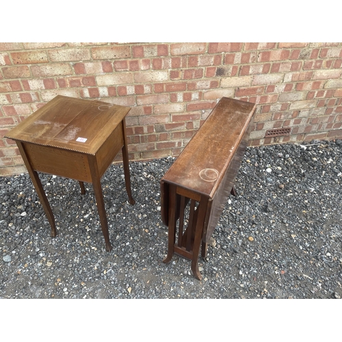 31 - An Edwardian sewing box together with a Sutherland table