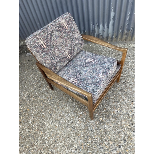 316 - A mid century teak framed armchair