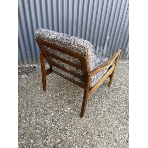 316 - A mid century teak framed armchair