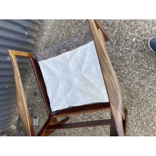 316 - A mid century teak framed armchair