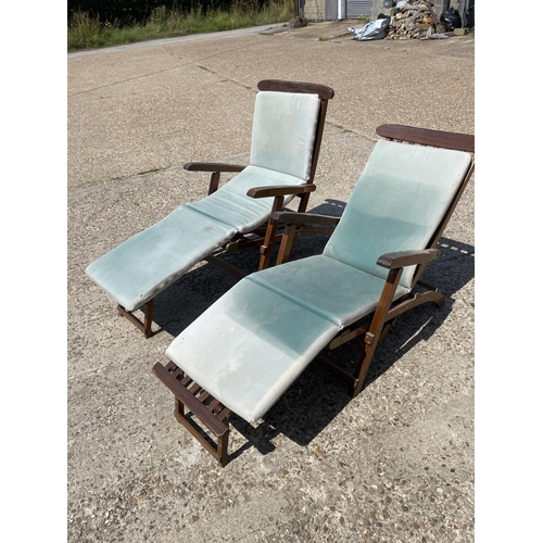 325 - A pair of hardwood steamer style garden lounger chairs with cushions