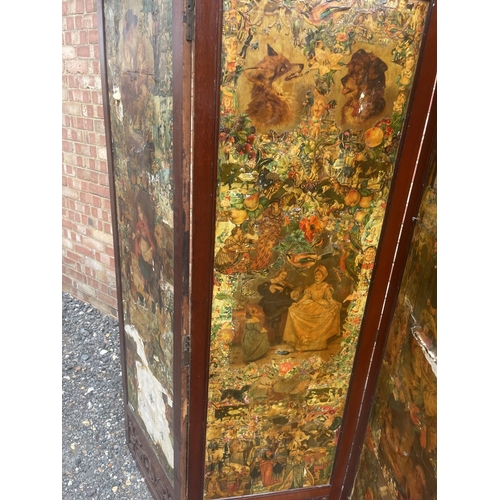 33 - A mahogany framed four section folding screen with Victorian paper scrap panels to front and red and... 