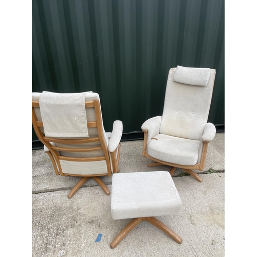 331 - A pair of Ercol swivel and recline armchairs with one footstool