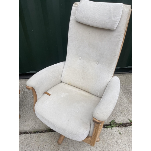 331 - A pair of Ercol swivel and recline armchairs with one footstool