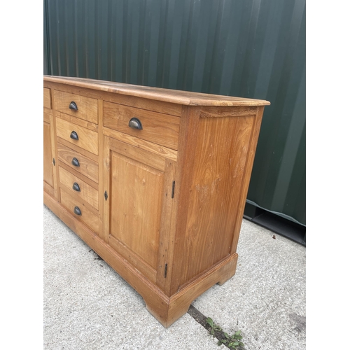 337 - A farmhouse style pine sideboard fitted with seven drawers and two cupboards 160x 50x90