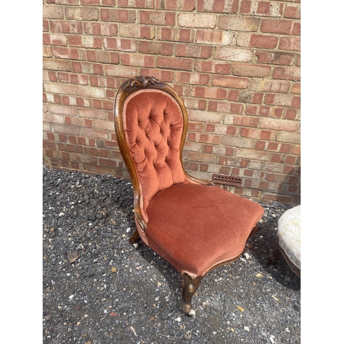 34 - A pink upholstered walnut framed Victorian spoon back Ladies chair together with a Victorian button ... 