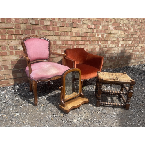 35 - A pink upholstered french style chair, red upholstered chair, bobbin stool and a swing mirror