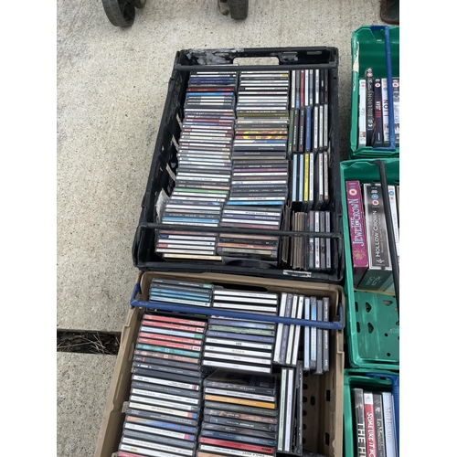 350 - Five trays of assorted DVDS AND cds