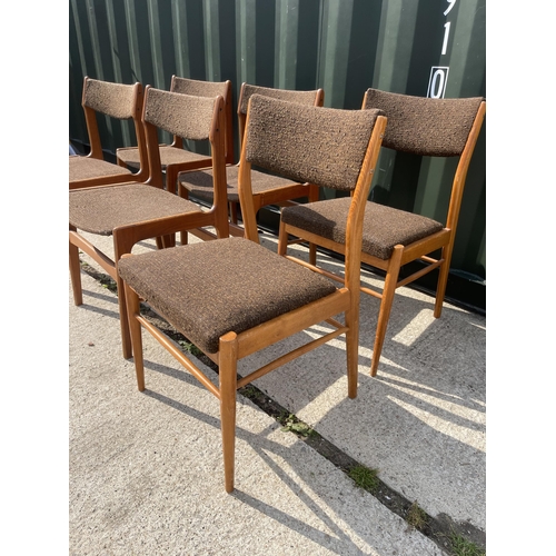 353 - A set of six mid century teak dining chairs marked MADE IN DENMARK