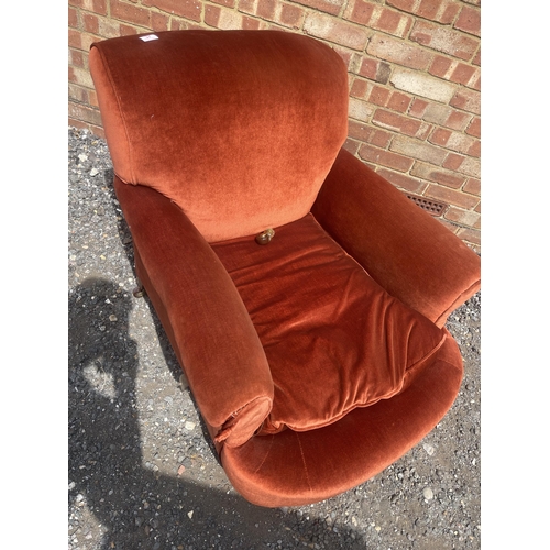 37 - A deep seated red upholstered armchair