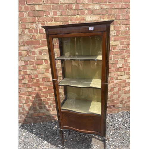 5 - An Edwardian inlaid mahogany display cabinet with shaped glass door 66x32x167