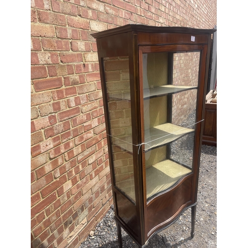 5 - An Edwardian inlaid mahogany display cabinet with shaped glass door 66x32x167