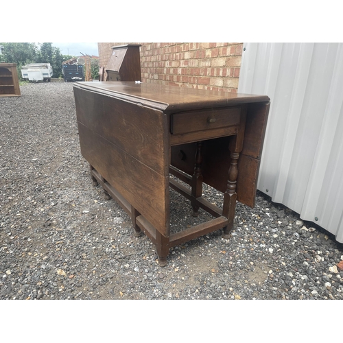 51 - An antique gateleg table with drawer to each end