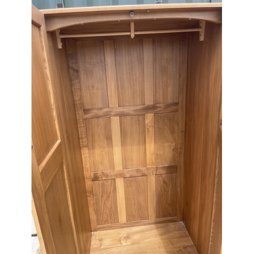 54 - Ercol light elm double wardrobe 90 x 53 x 180 cms