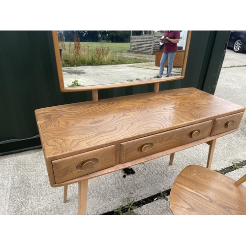 55 - Ercol light elm three drawer dressing table together with chair