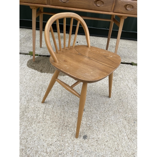 55 - Ercol light elm three drawer dressing table together with chair