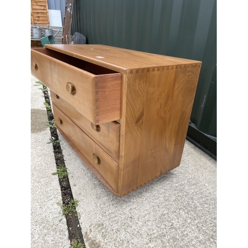 56 - Ercol light elm chest of three drawers 92 x 44 x 66 cms