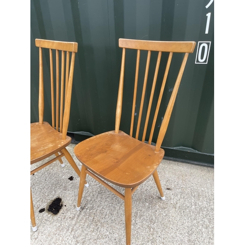 57 - Pair of Ercol stickback dining chairs