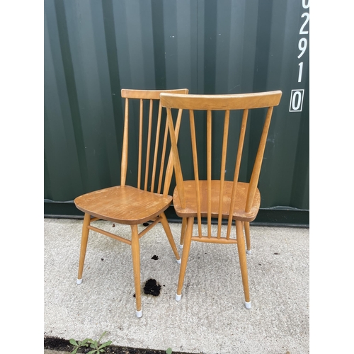 57 - Pair of Ercol stickback dining chairs