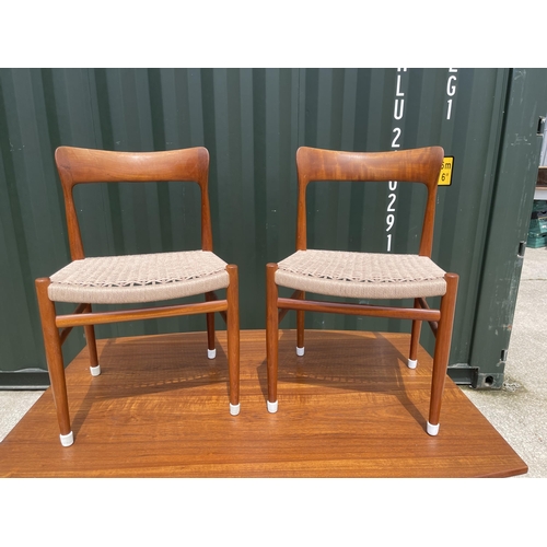 59 - Danish Teak draw leaf dining table together with a set of four Danish Teak dining chairs with string... 